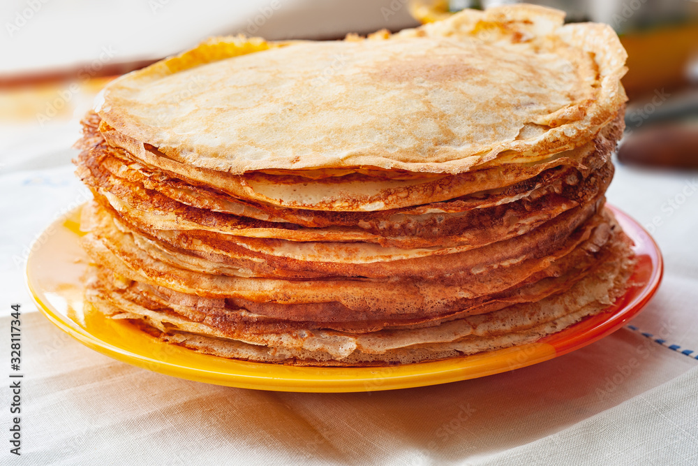 Stack of pancakes. Thin fragrant pancakes in a plate. Traditional rustic food.