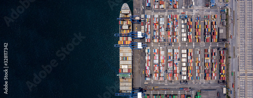 Container ship loading and unloading in deep sea port, Aerial view of business logistic import and export freight transportation by container ship in open sea, Container loading Cargo freight ship.