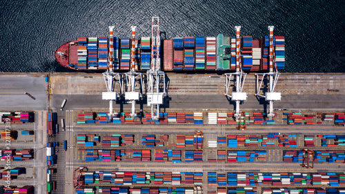 Photography Container ship loading and unloading in deep sea port, Aerial view of business logistic import and export freight transportation by container ship in open sea, Container loading Cargo freight ship