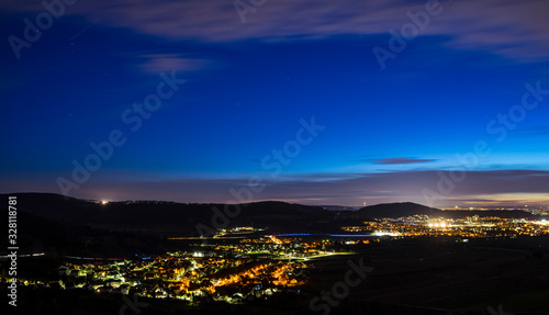 Germany, Illuminated houses, streets and buildings of winnenden district hoefen city by night, aerial view above in magical atmosphere photo