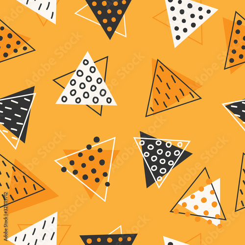 Geometric seamless pattern made of triangles. Decorated with circles and lines. Hand-drawn background. Modern design.