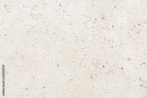 white concrete wall with small stones in it. cold minimalist background design
