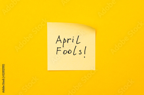 april fools day reminder on yellow sticky note. be aware and do not let be fooled