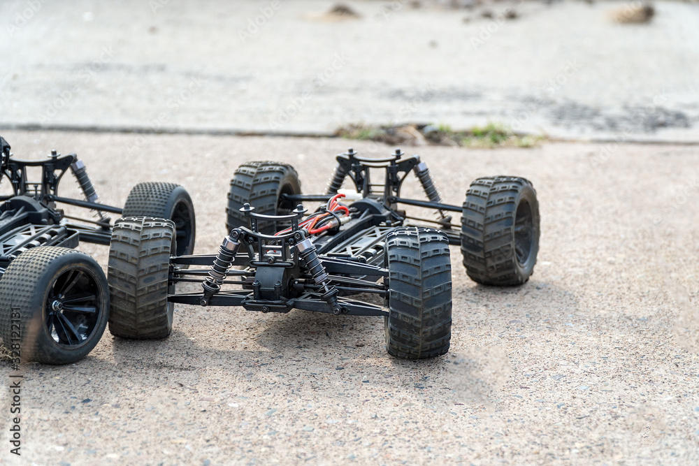 Disassembled RC model racing cars. Model cars without top Disassembled RC model racing cars. Model cars without top