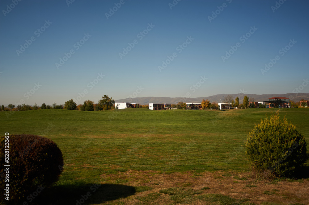 Fototapeta premium Beautiful view of the green golf field