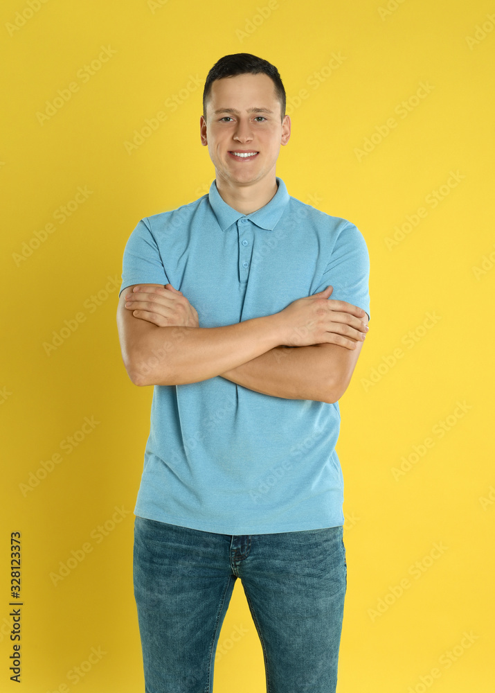 Happy handsome young man on yellow background Happy handsome young man on yellow background