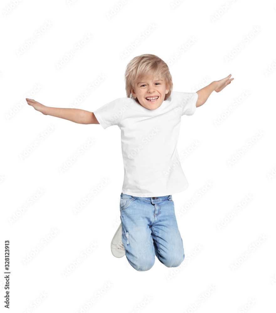 Happy little boy jumping on light grey background Happy little boy jumping on light grey background