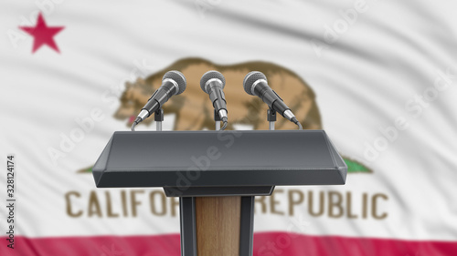 Podium lectern with microphones and California flag in background