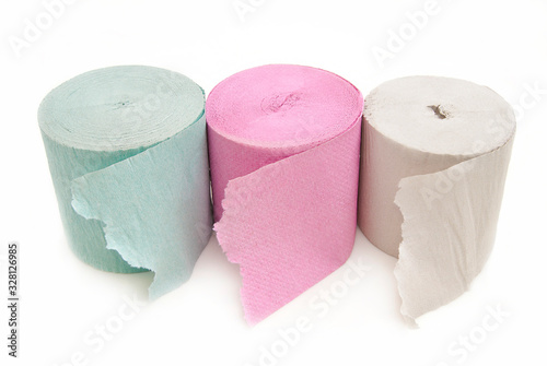 Toilet paper in three colors on a white background.