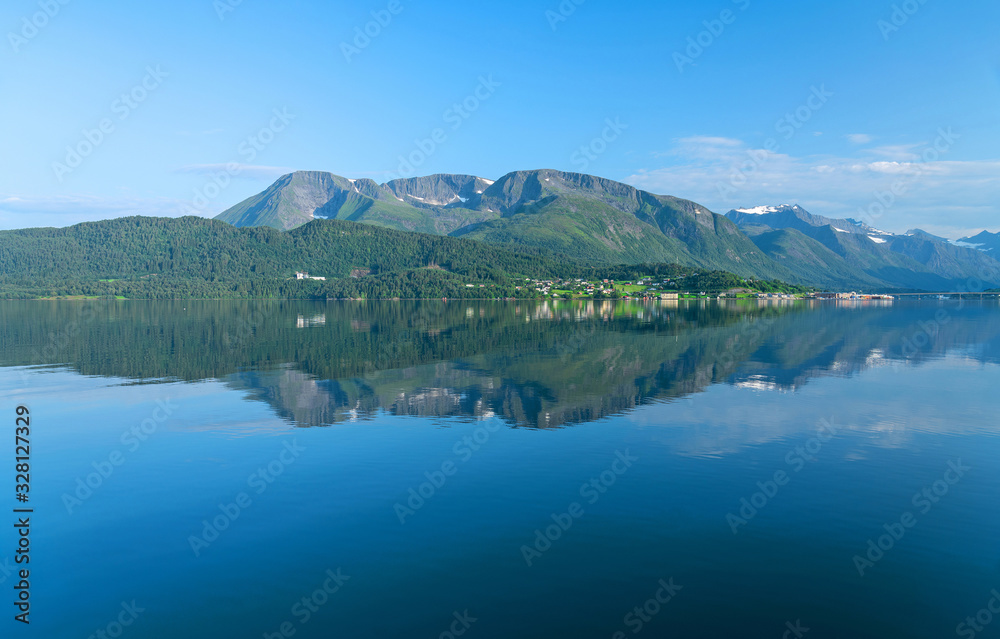 Norway - mountain sea view with reflection in summer. Norwegian fjords panoramic picturesque landscape.