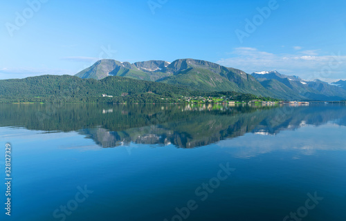 Fototapeta Naklejka Na Ścianę i Meble -  Norway - mountain sea view with reflection in summer. Norwegian fjords panoramic picturesque landscape.