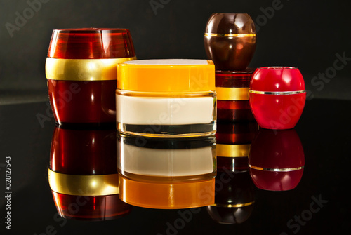 Multicolored bottles of cream.