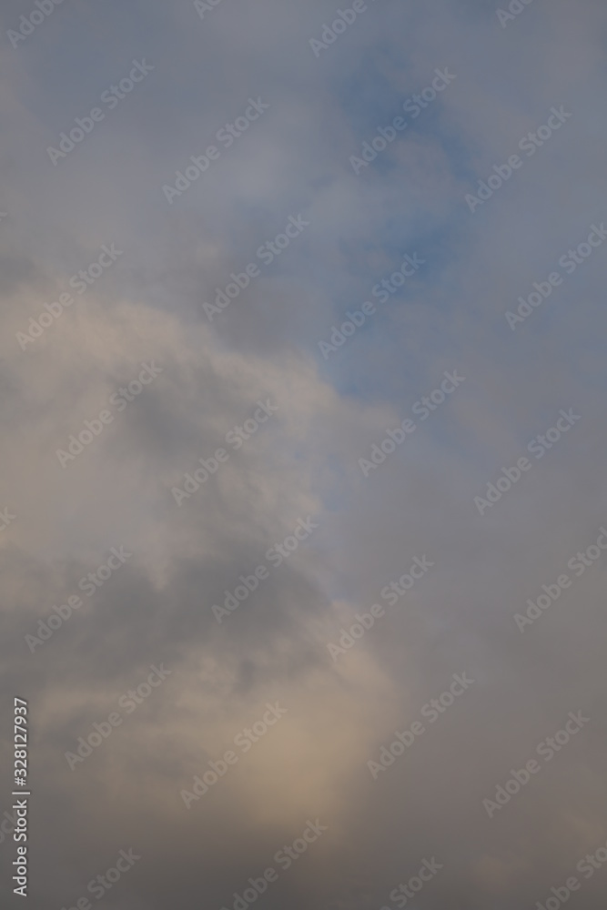 Fototapeta premium Clouds with sunlight and blue color during evening sunset 