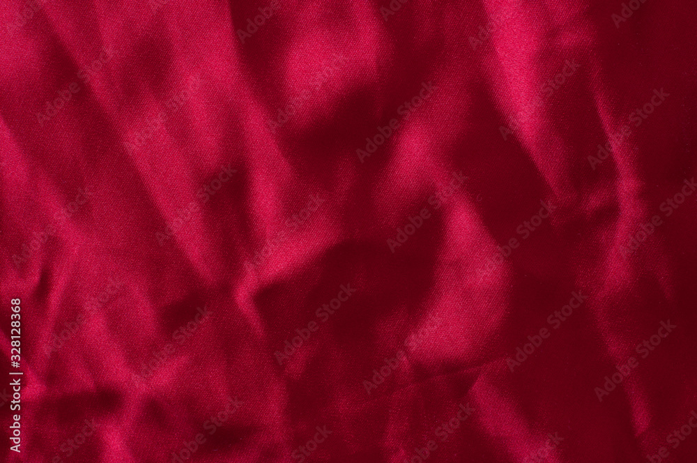 Red wrinkled satin fabric. Background. Red wrinkled satin fabric. Background.