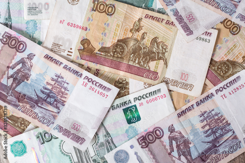 Paper banknotes Russian Rubles. Rubles is the national currency of Russia. bank of Russia The Russian ruble background. A thousand rubles close-up. Fall or rise of the ruble. Paper banknotes Russian Rubles. Rubles is the national currency of Russia. bank of Russia The Russian ruble background. A thousand rubles close-up. Fall or rise of the ruble.