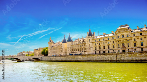 View across the Seine to the conciergerie in Paris on a beautiful summer day