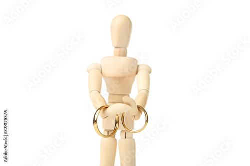 Wooden figure holding two golden rings isolated on white background