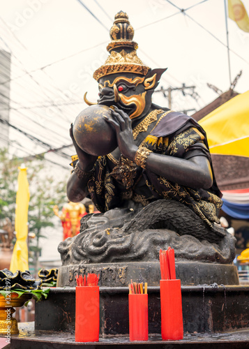 Chi Chi Sticks Used to predict the future To the Rahu statue At Huai Khwang market, Bangkok, Thailand photo