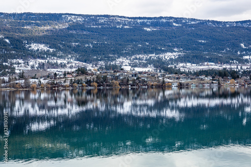 View of town reflected in a lake. Lake Country, Okanagan, British Columbia