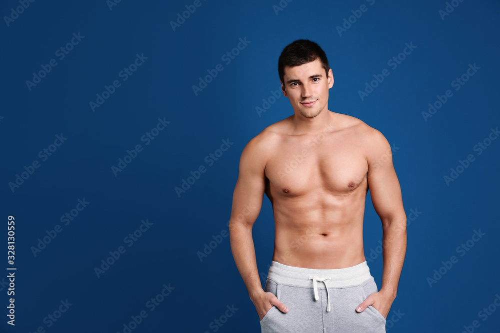 Man with sexy body on blue background