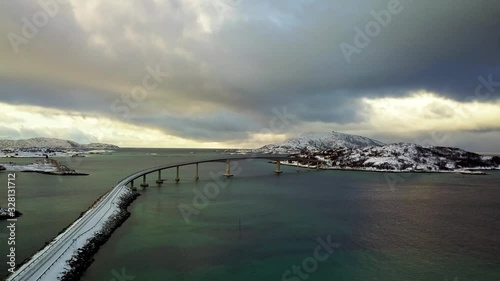 Wallpaper Mural vue aérienne en drone du pont de Sommaroy en Norvège du nord en hiver au coucher du soleil sous les nuages menaçants d'une tempete de neige Torontodigital.ca