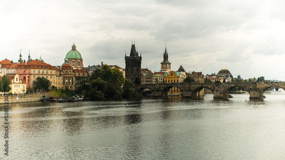 View of Charles bridge over Vltava River with old town in background, Prague, Czech Republic View of Charles bridge over Vltava River with old town in background, Prague, Czech Republic