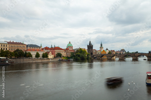 View of Charles bridge over Vltava River with town in Prague, Czech Republic