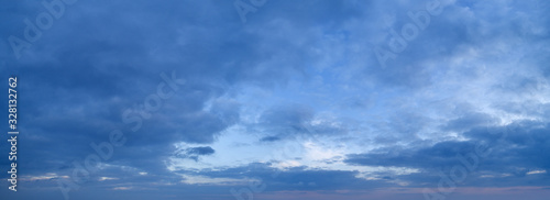 Photography Large panorama of evening sunset sky with beautiful clouds.