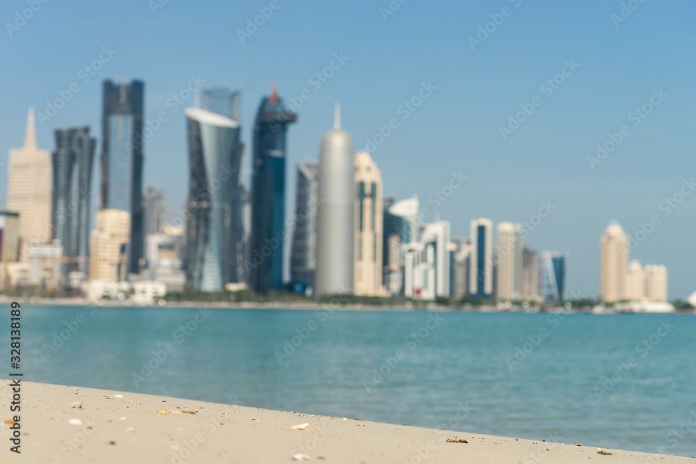 View of city center with skyscrapers from the Beach in Doha, Qatar View of city center with skyscrapers from the Beach in Doha, Qatar