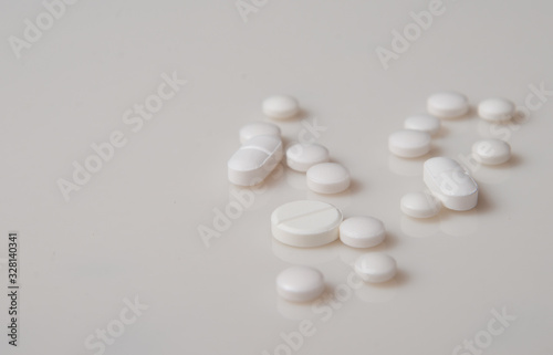 Pharmaceutical concept. Pills on a light background.