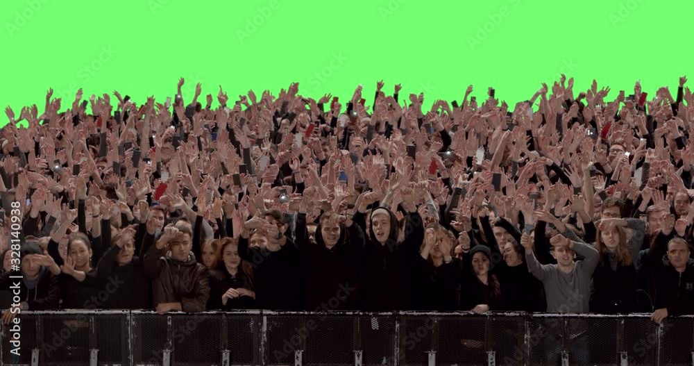 GREEN SCREEN CHROMA KEY Model released, Front view of huge crowd dancing and cheering at a concert or a show behind control barrier. Shot on RED Helium 8K Prores 4444