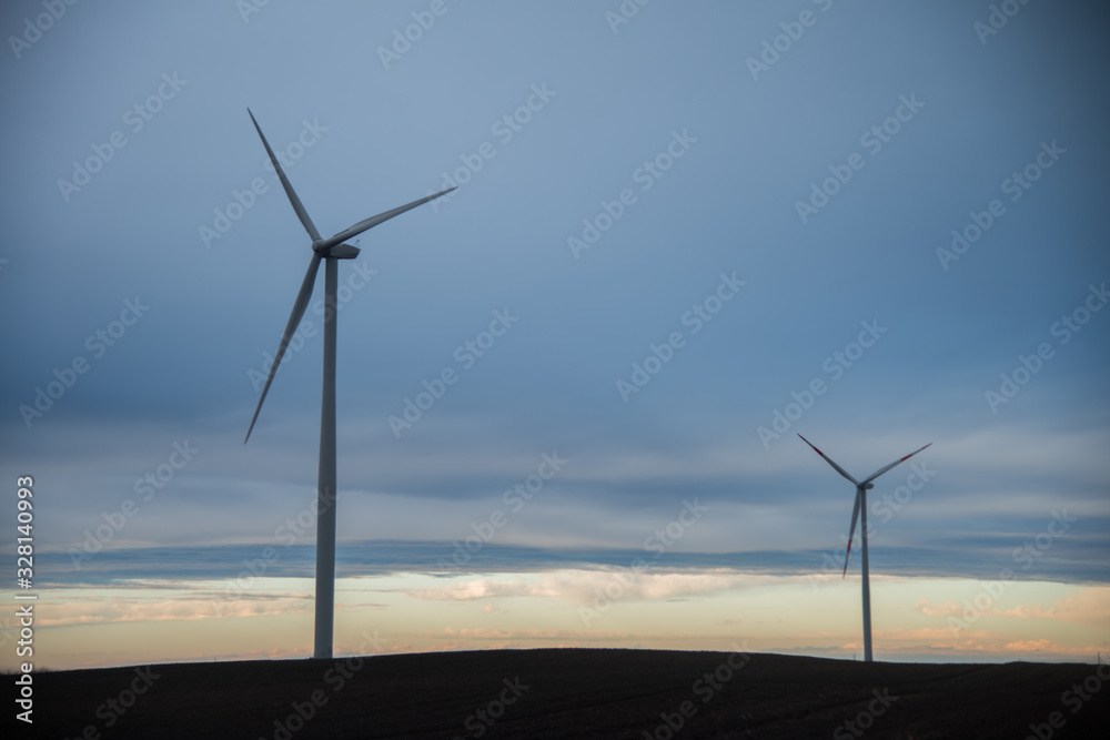 Windmills with cloudy weather and gloomy clouds