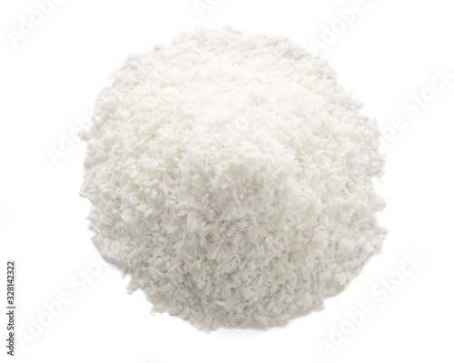 Heap of fresh coconut flakes isolated on white, top view