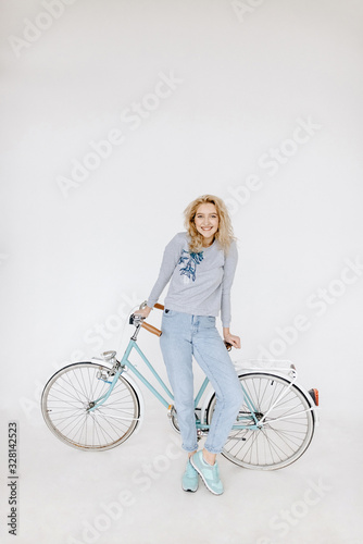 Fashion girl portrait with bicycle photo