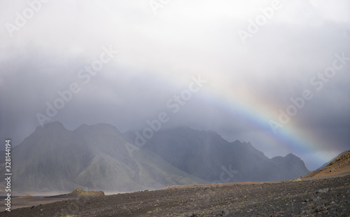 Panoramic view with Volcanic landscape during rain with rainbow over the mountain. Iceland, Laugavegur hiking trek