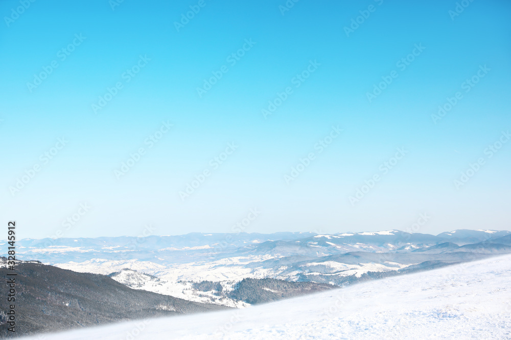 Beautiful view on snowy mountains. Winter vacation