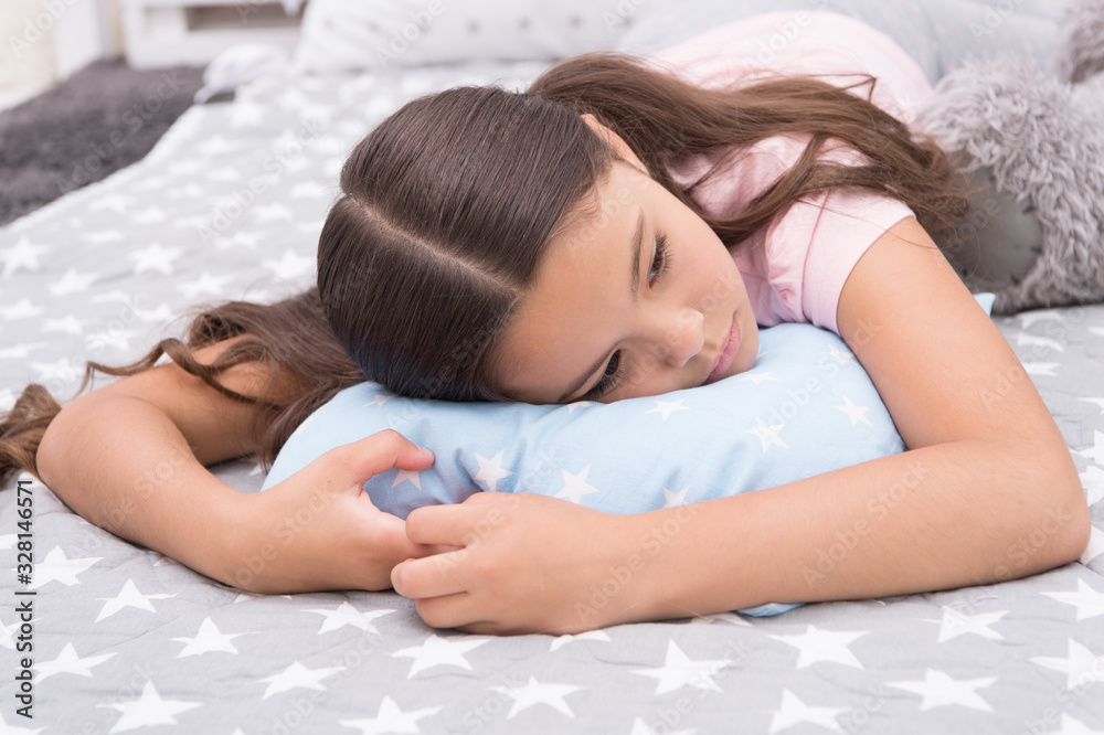 Sleepy beauty. Sleepy baby. Small girl relax in bed. Little child with sleepy look. Early morning or late evening. Bedtime routine. Nap time. She feels sleepy Sleepy beauty. Sleepy baby. Small girl relax in bed. Little child with sleepy look. Early morning or late evening. Bedtime routine. Nap time. She feels sleepy