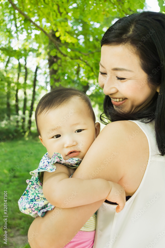Happy Asian mother-baby portrait outdoors Happy Asian mother-baby portrait outdoors