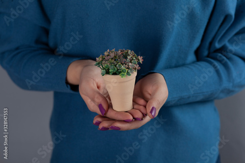 woman hand artificial flower