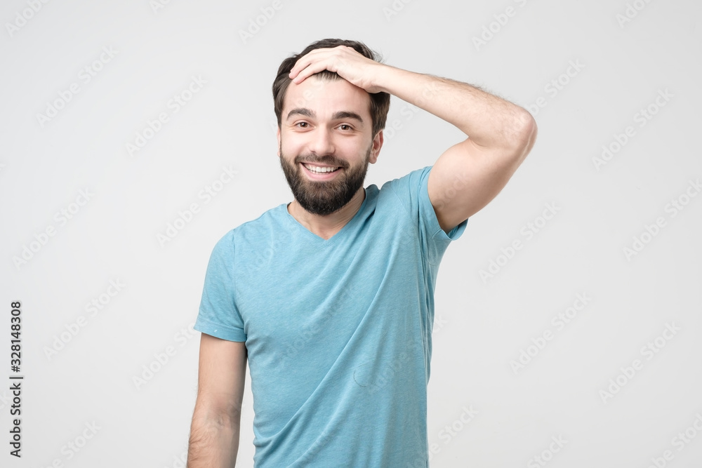 Guy with beard holding hand on head glad that he remember important thing Guy with beard holding hand on head glad that he remember important thing