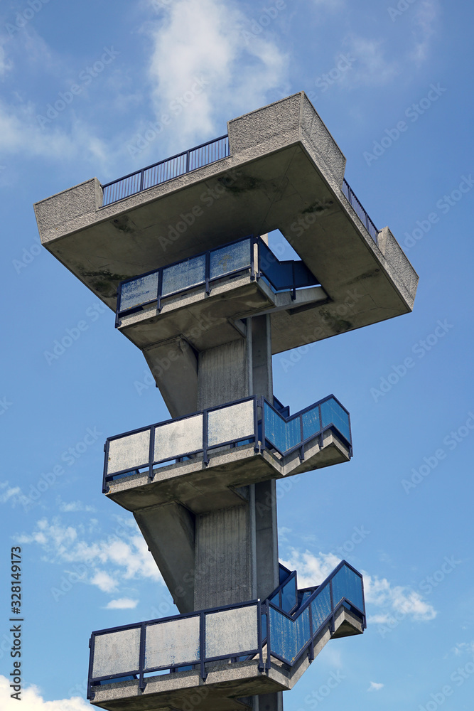 Brutalist tower against blue sky