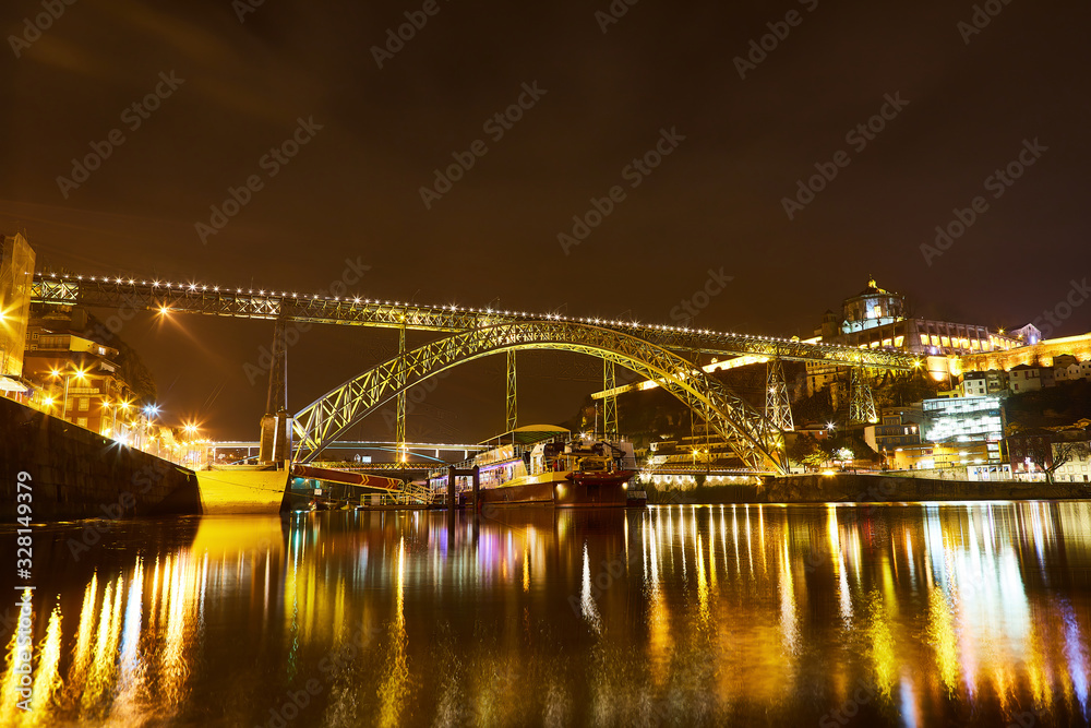 Night View of cityscape of Porto, Portugal over Dom Luis I Bridge and Douro River