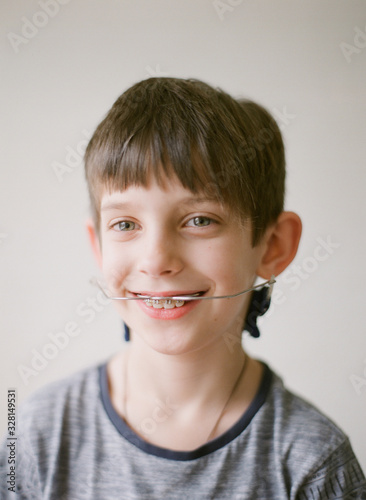 happy boy with braces and headgear photo