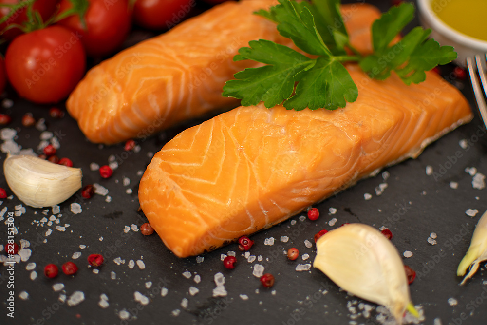 Cooked salmon fish fillets with spices, selective focus Cooked salmon fish fillets with spices, selective focus