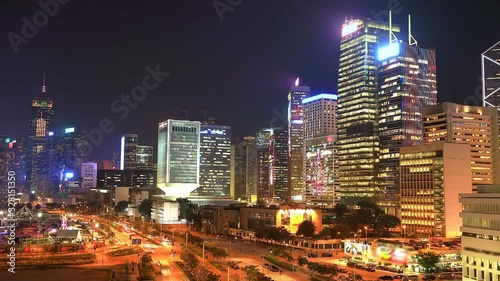 Spectacular aerial view of cityscape in Hong Kong, Central District, with city night traffic at Victoria Harbour illuminated. Wide view time lapse.