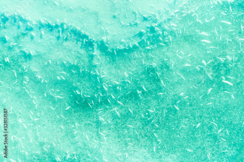 blue texture of an snow surface with pure ice white wave , blue cold clear cryslallized wall background ,decorative plaster background close up , abstract macro wallpaper