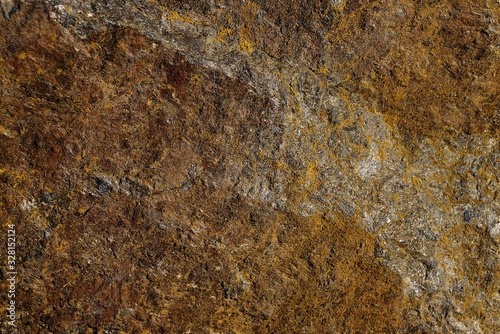 brown stone background from a piece of dirty granite