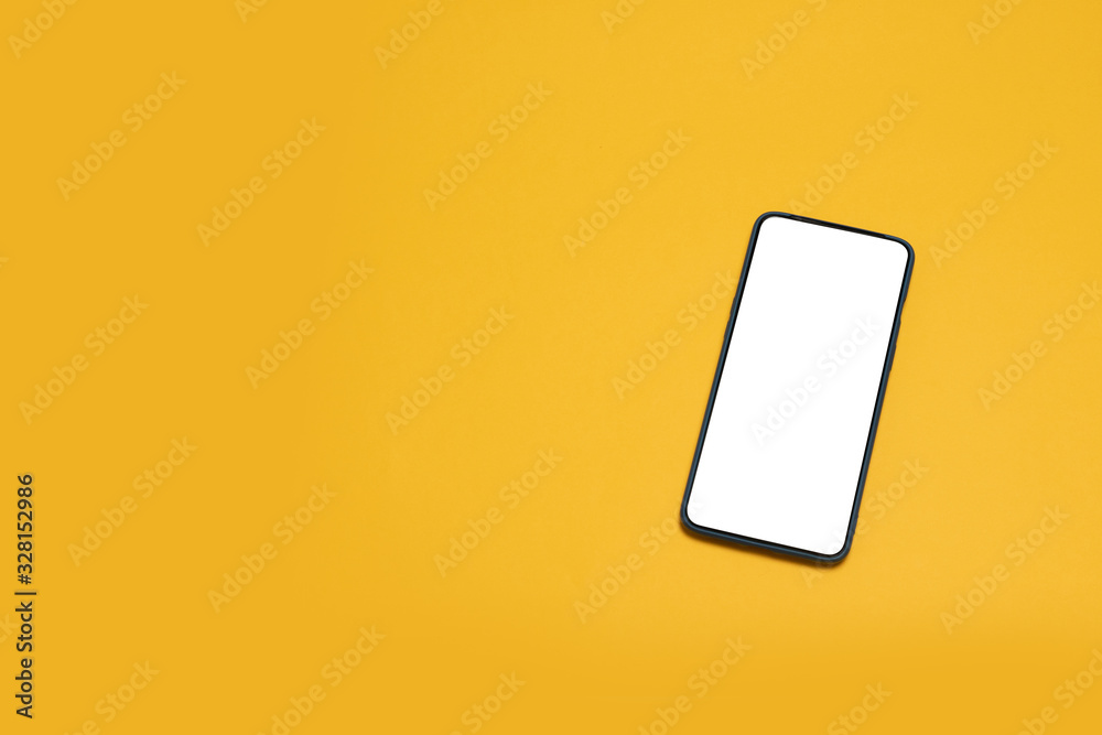 Top view mockup black smartphone on yellow background. Desktop blank smartphone Top view mockup black smartphone on yellow background. Desktop blank smartphone
