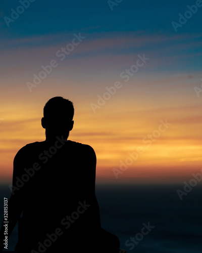 silhouette of man at sunset