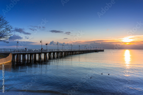 Beautiful landscape with wooden pier in Gdynia Orlowo at sunrise  Poland